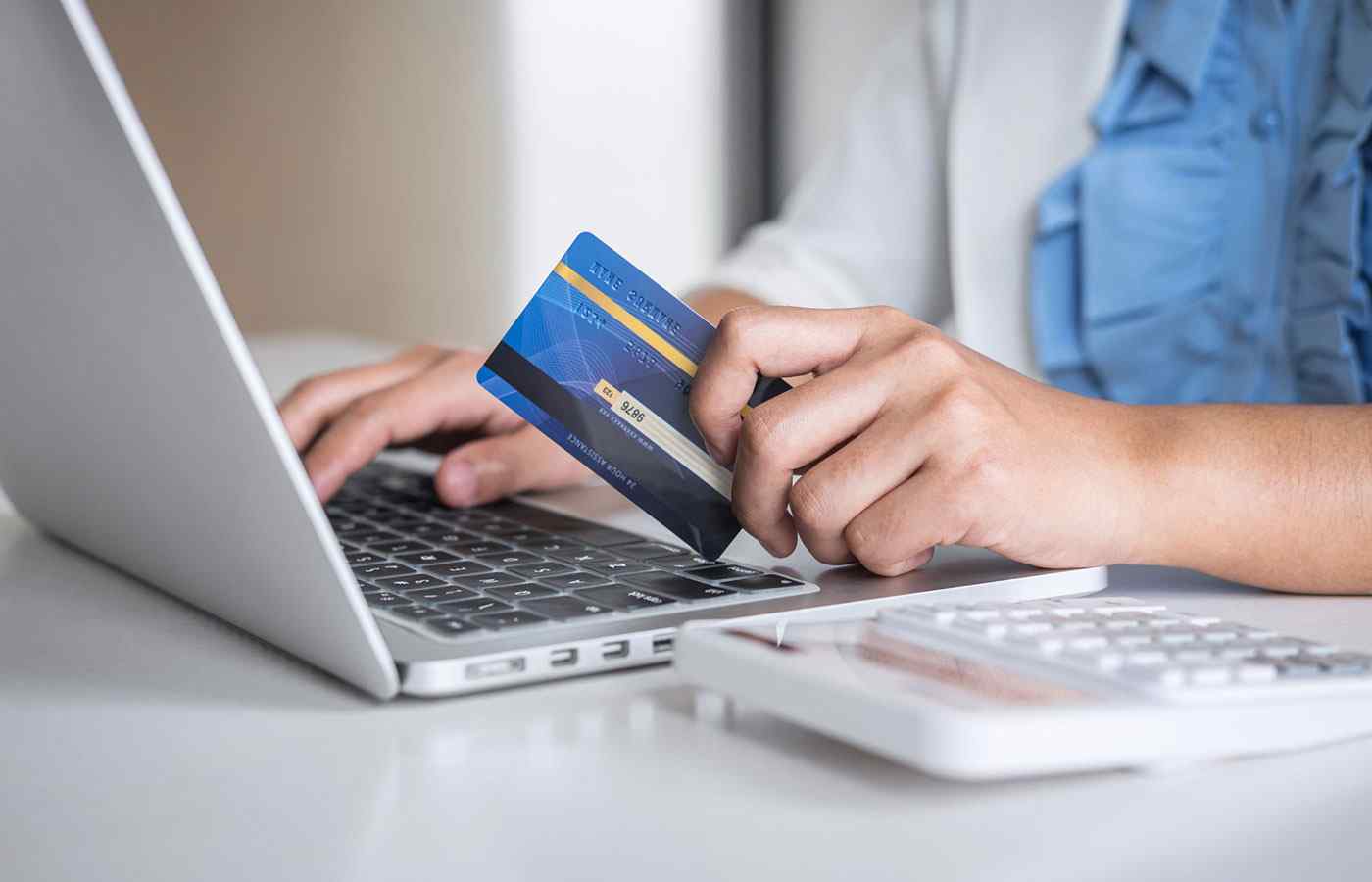 Man using credit card to buy things online