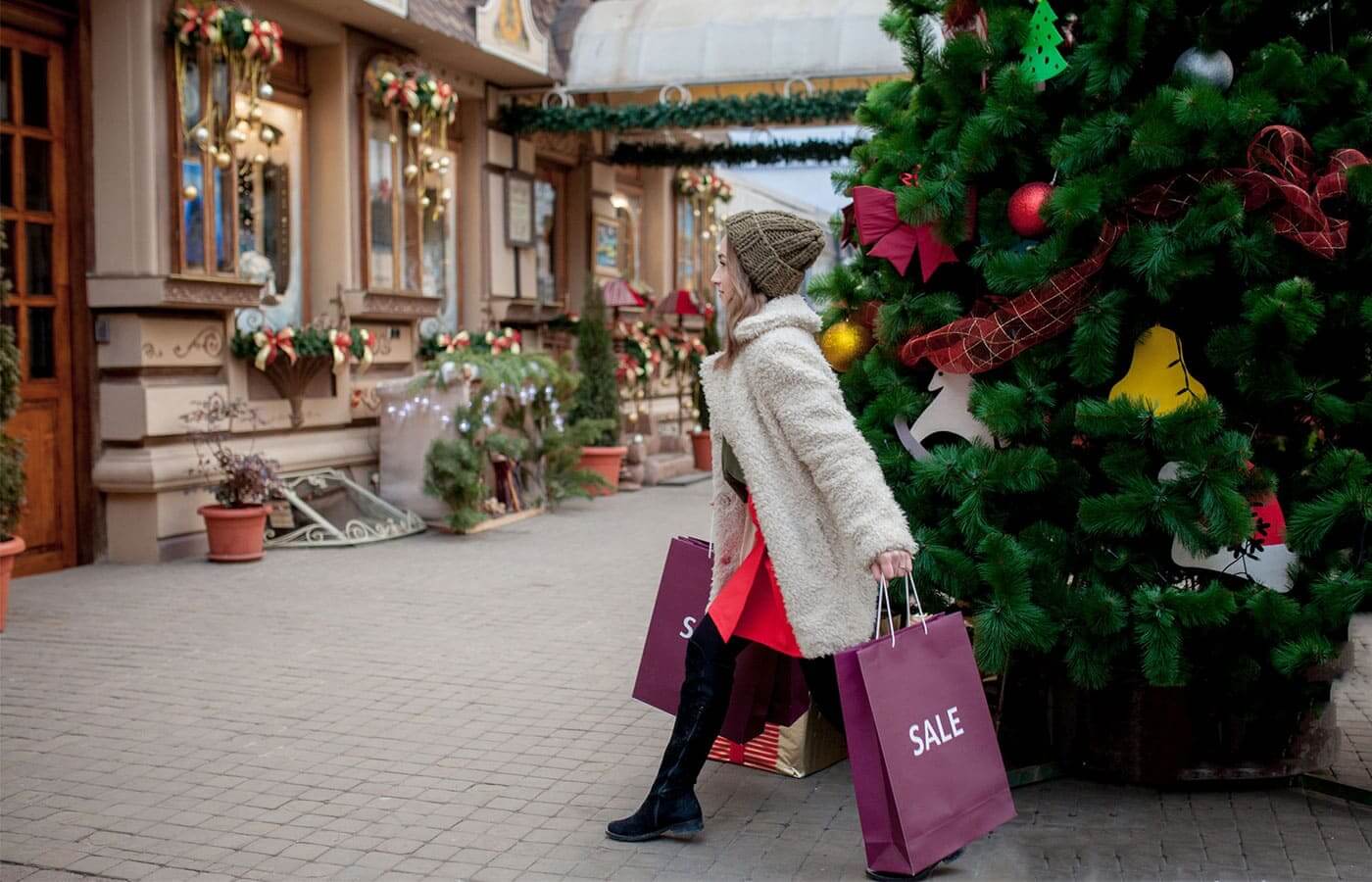 A young woman doing her Christmas shopping while the sales are still on