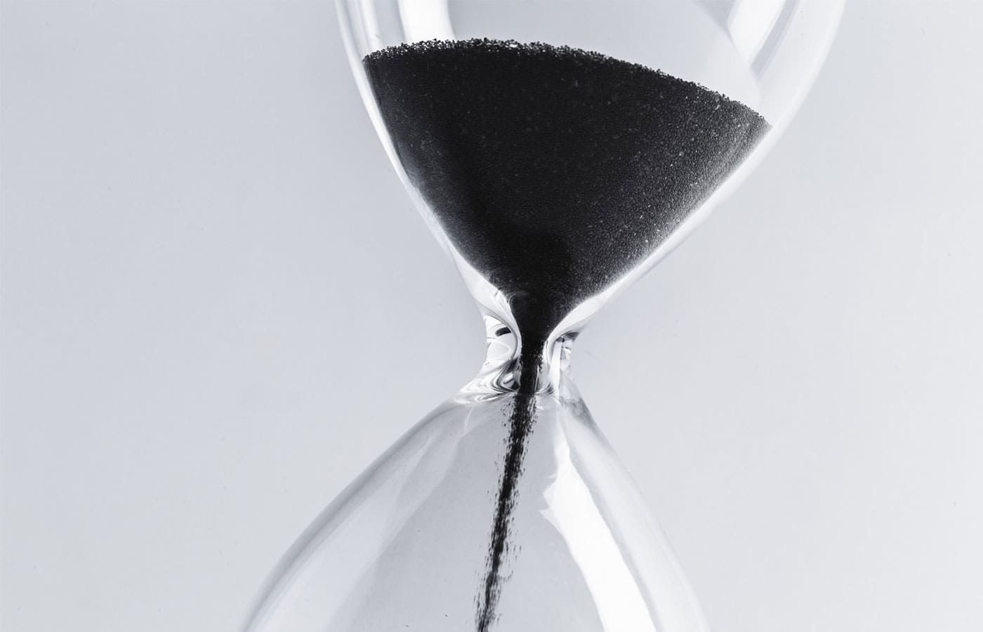 Hour glass with sand dropping down