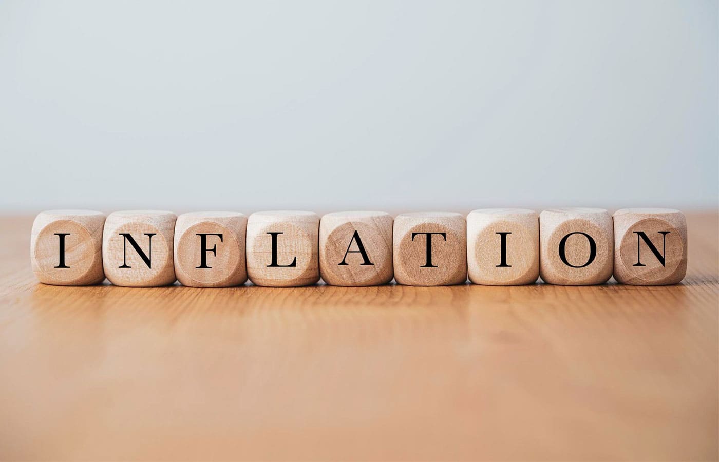 Dice with letters spelling out the word inflation