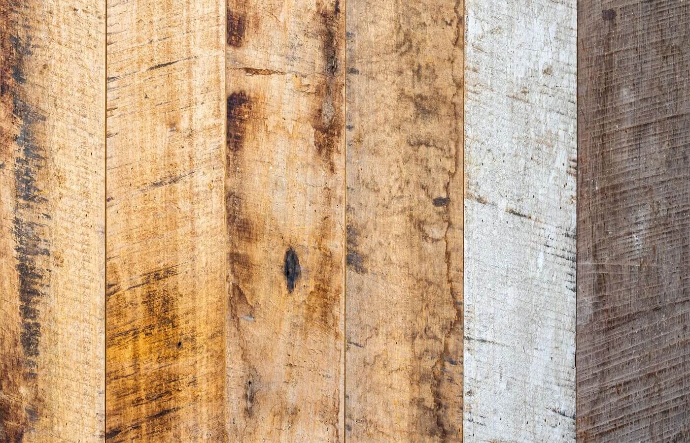 A collection of rustic wooden planks aligned next to each other