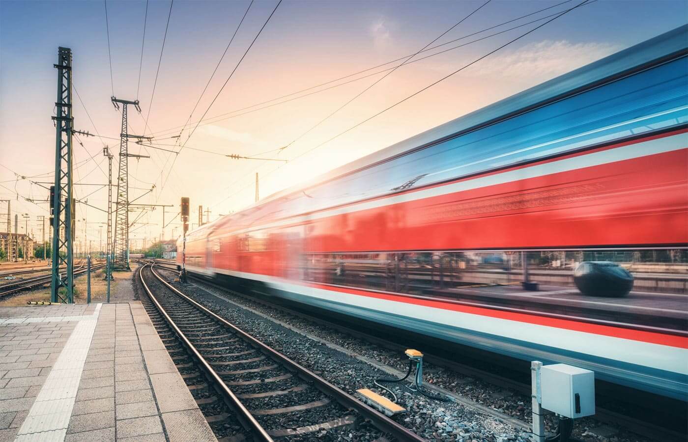 A train traveling at high speed through a station