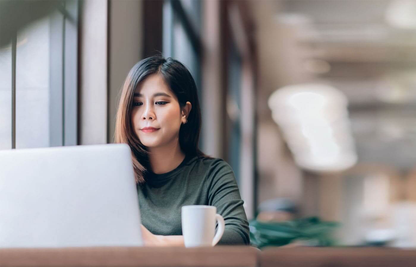Young woman looking at her investment portfolio online
