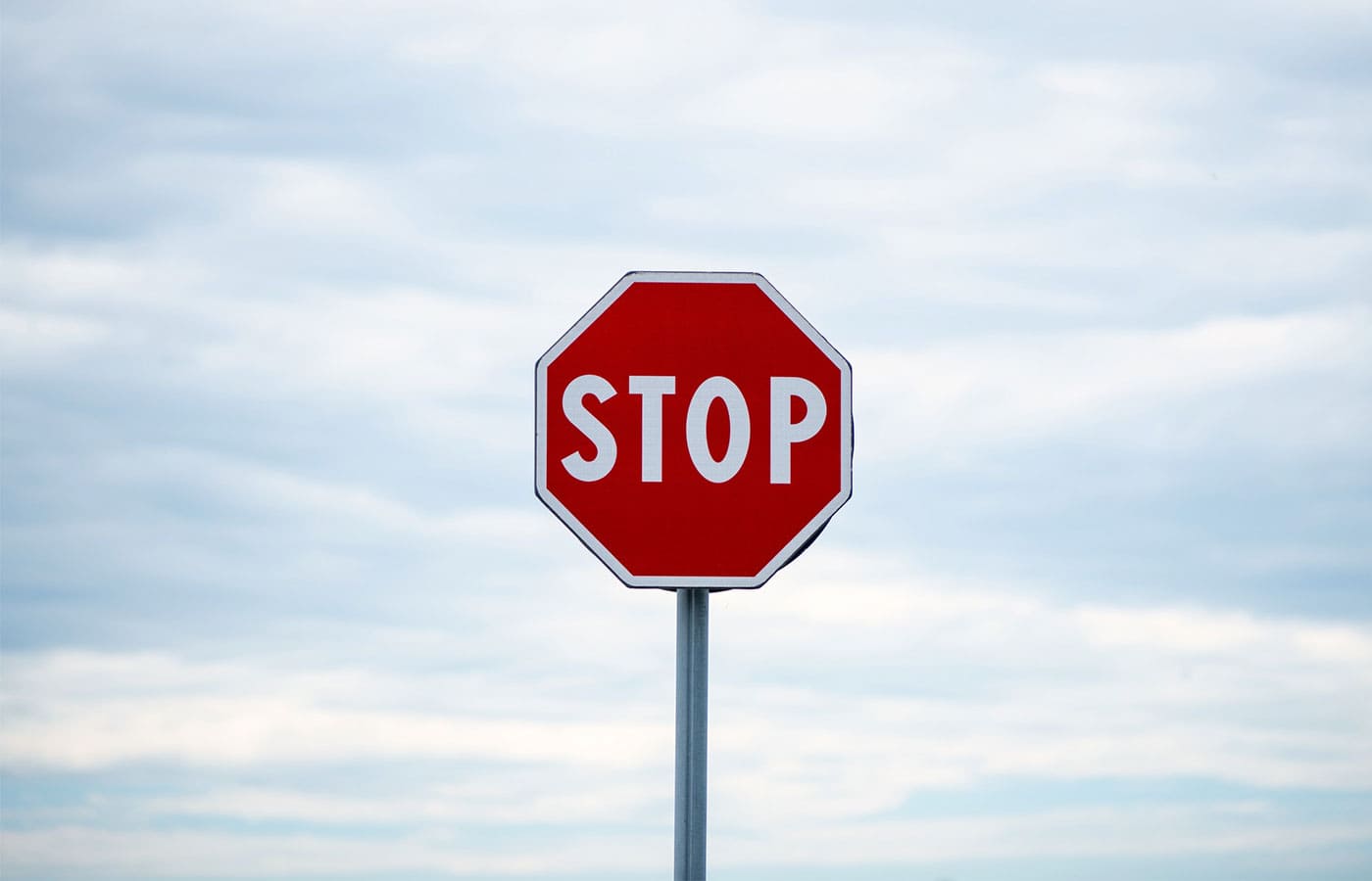 Stop sign on a cloudy day
