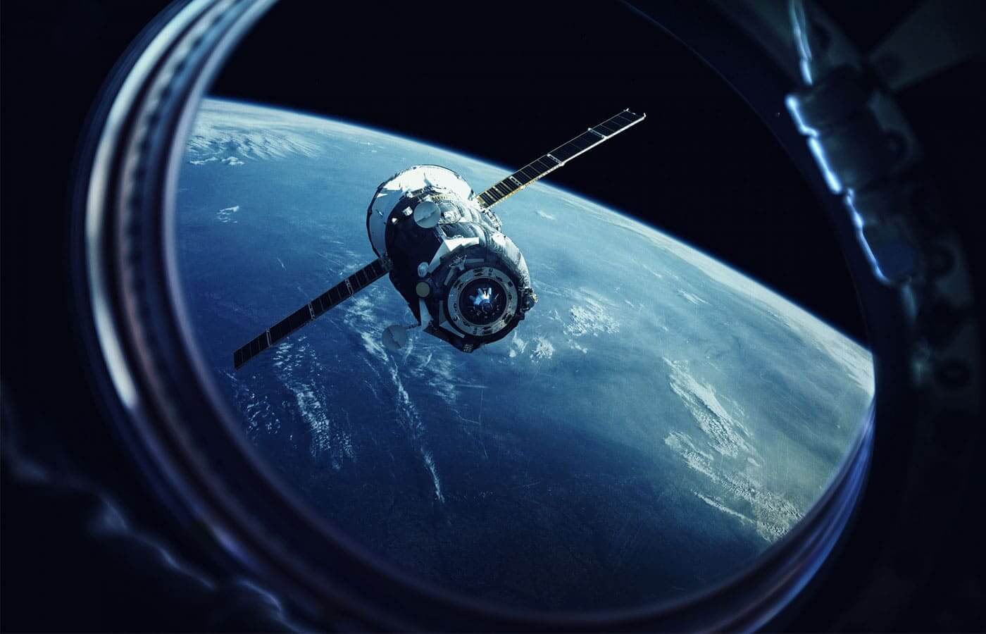 View from a spaceship looking at a satellite in front of planet Earth