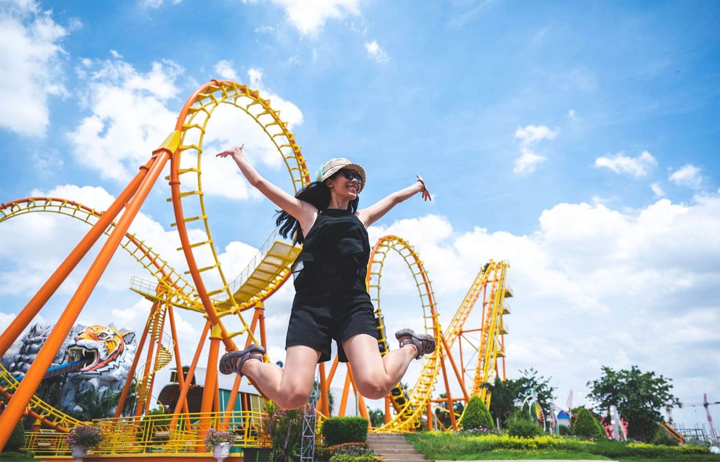 Young woman celebrating at a theme park