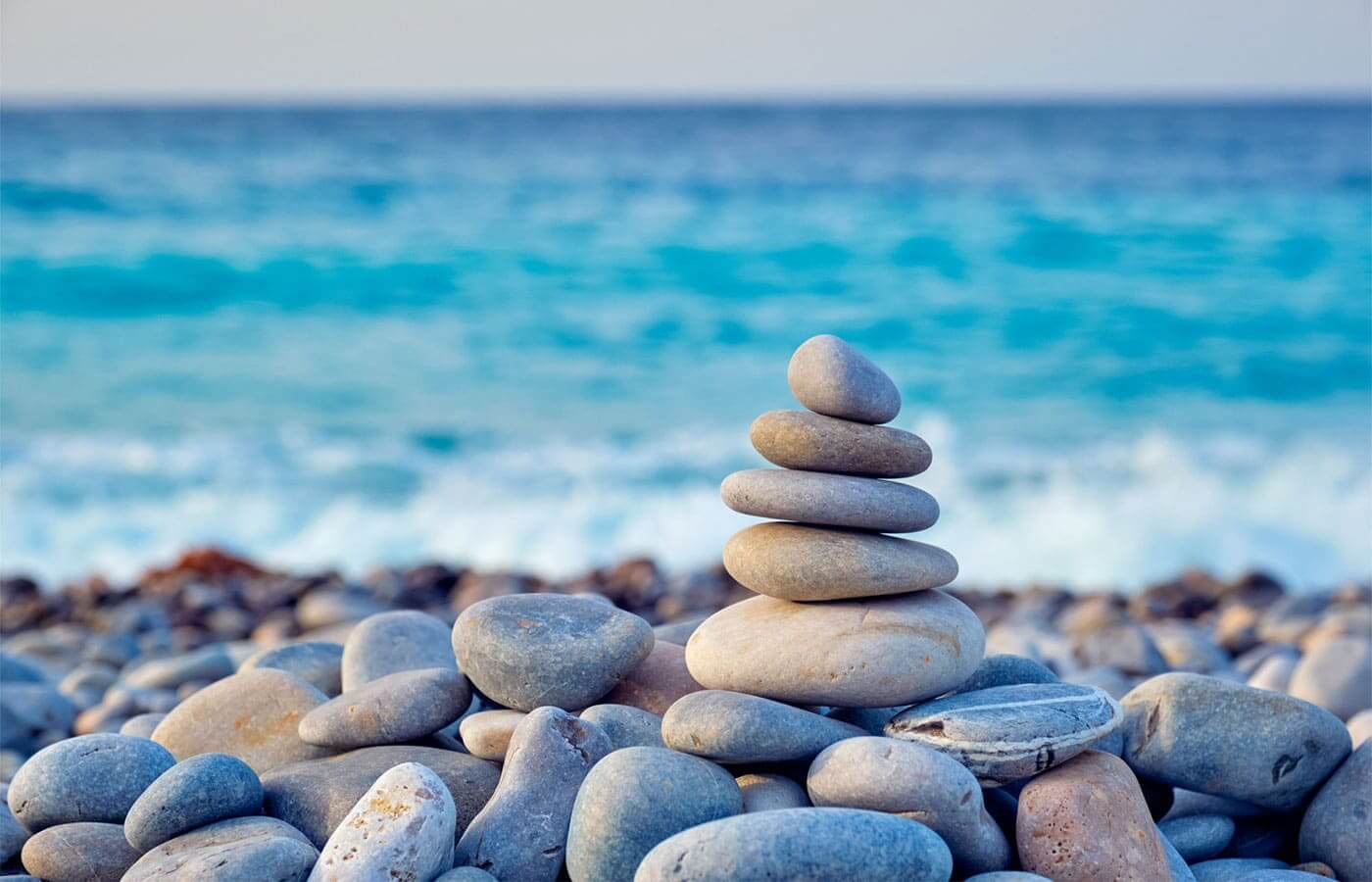 Pile of rocks on a beach being balanced